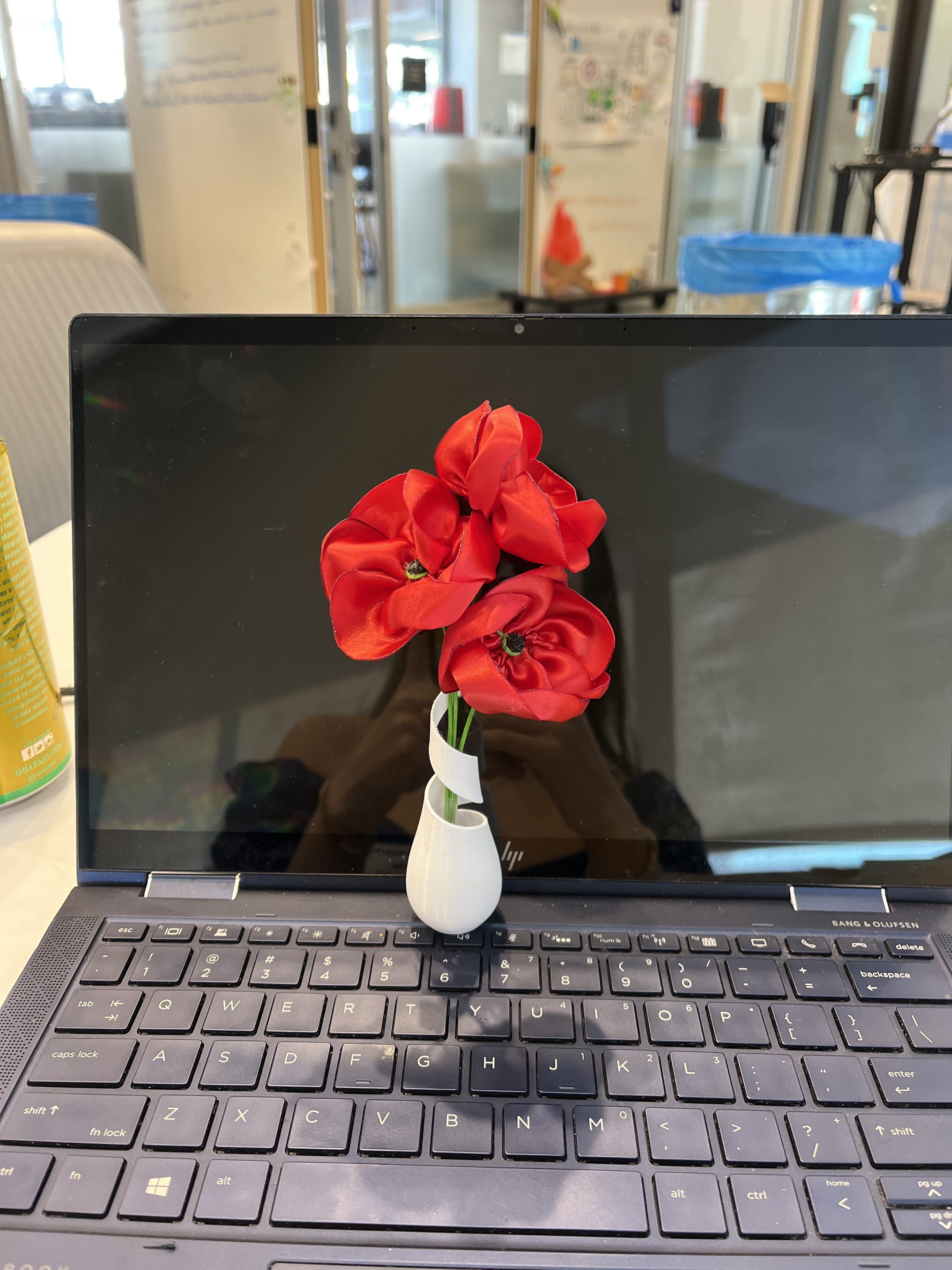 3D printed white vase with red flowers
