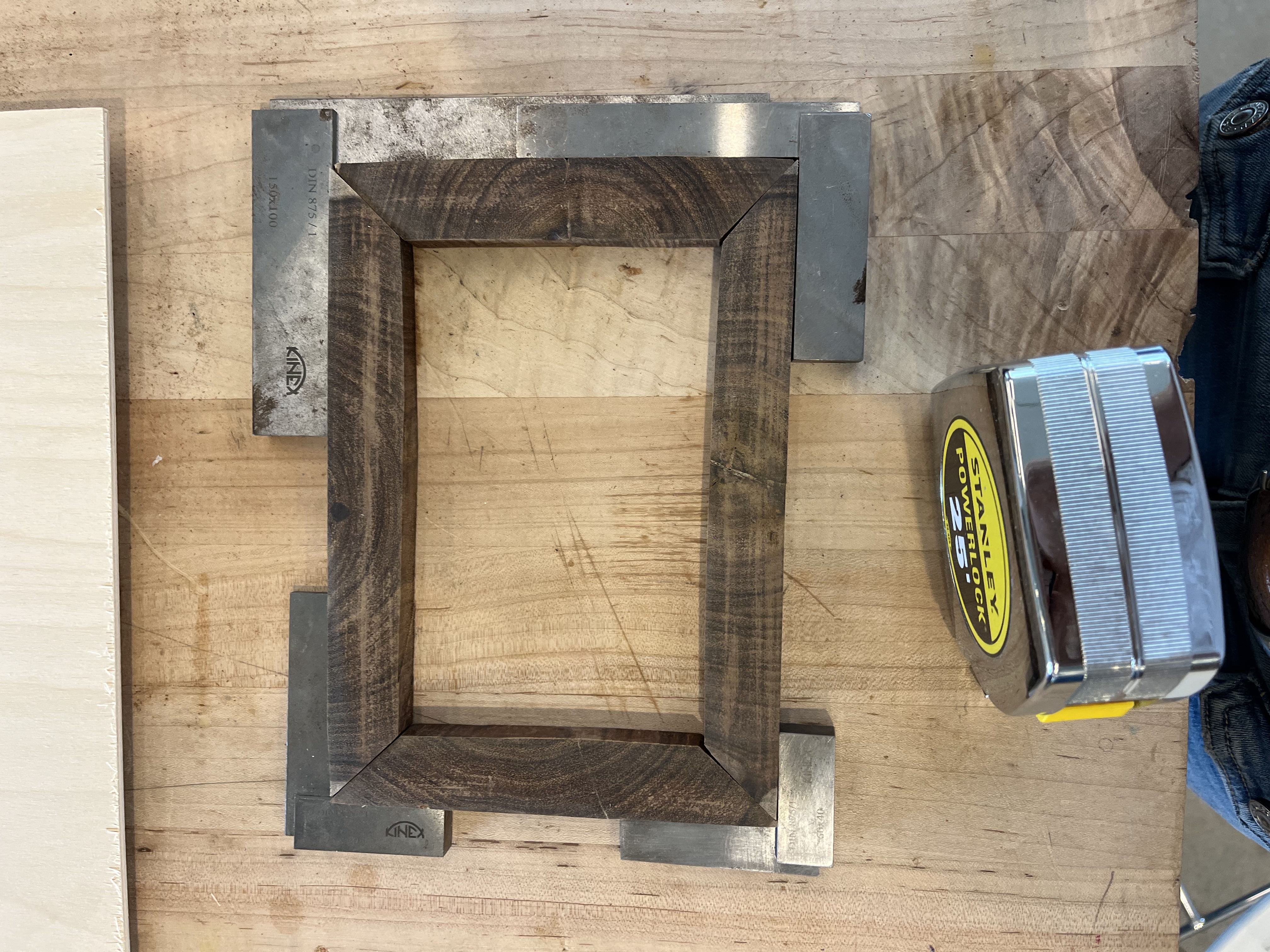 Wooden frame with metal corner brackets